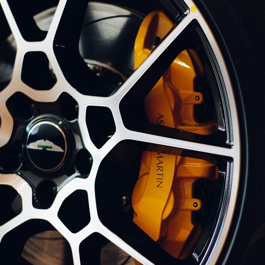 Close-up of a performance brake caliper and alloy wheel